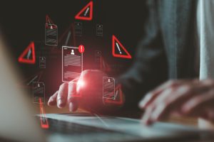 Close up shot of people point to access to personal data and document with warning sign as concept of data breach or attack from hacker or spyware. Data security concept.