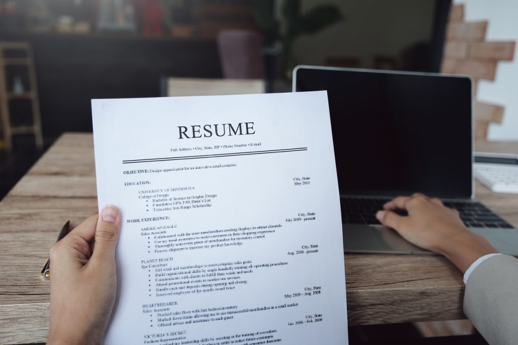 hr audit resume applicant paper and interview with using computer laptop for selection human resource to company.